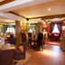 Premier Inn Rugeley dining area with tables, chairs and warm lighting