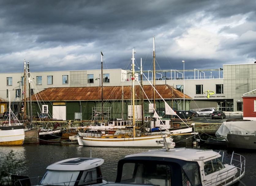 P-Hotels Brattøra in Trondheim overlooking a marina with sailboats under dramatic clouds