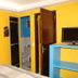 Pousada Innova room in Natal with bed, TV, and open bathroom door