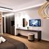 Melpo Antia Hotel & Suites in Ayia Napa room with bed, wall art, vanity desk and wall-mounted TV