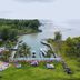 Sanghyang Indah Spa resort in Anyar with oceanfront lawn, palm trees, and a small marina