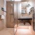 Thalazur Ouistreham - Hôtel & Spa bathroom with glass shower, vanity, mirror and heated towel rail in Ouistreham