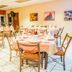 Gran Hotel Paris in La Ceiba dining room with round tables set for a banquet
