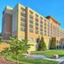 Sheraton Baltimore Washington Airport Hotel - Bwi in Linthicum Heights, exterior with landscaped lawn and clear blue sky