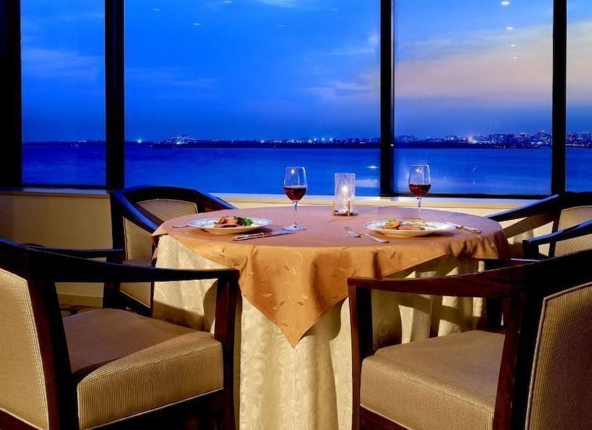 Tokyo Bay Maihama Hotel First Resort in Urayasu with waterfront dining table and bay view at dusk