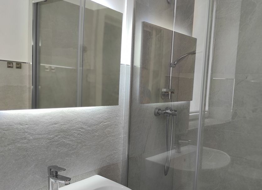 Palazzo Verdi Holiday Viterbo bathroom with glass shower and modern sink in Viterbo