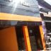 Hotel Flert Santana in Sao Paulo with orange storefront and glass entrance