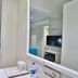 Glamour Hotel Istanbul Sirkeci guest room with turquoise bed, mirror vanity and wall-mounted TV in Istanbul