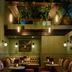 Hotel du Vin Henley lounge in Henley-on-Thames with tufted seating, small tables and hanging plants