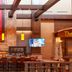 Prairie Band Casino & Resort in Mayetta lobby bar with brick fireplace, stained-glass emblem and high stools