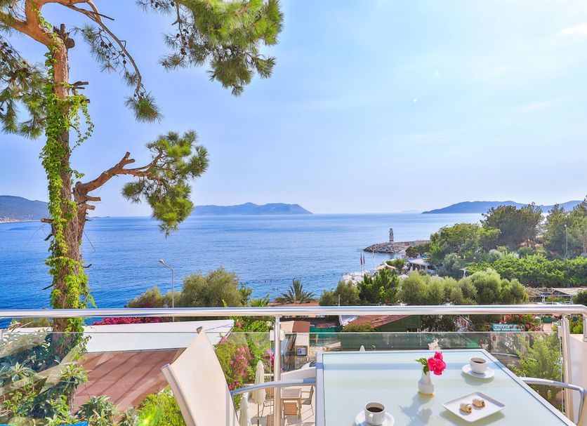 Gardenia Hotel in Kaş with sea view from a balcony overlooking the coast and lighthouse