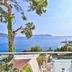 Gardenia Hotel in Kaş with sea view from a balcony overlooking the coast and lighthouse