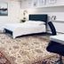 Ginkgo House on Harvard guest room in Cambridge with a bed, sofa, desk, and patterned rug