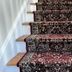 Almondy Inn Newport staircase with patterned runner carpet and wooden steps