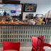 Ocean Beach Hotel in Miami Beach breakfast bar with pastries, fruit, and TV screens