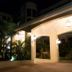 Constellation Hotel in Port Au Prince at night with illuminated covered entrance and tropical landscaping