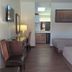 Western Inn Motel & RV Park in Fairplay: room with two beds, desk, TV, and kitchenette