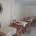 Nestor hotel in Zacháro dining room with tables and wooden chairs