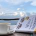 Everest Manla Resort in Nagarkot terrace with cup, book, and mountain view
