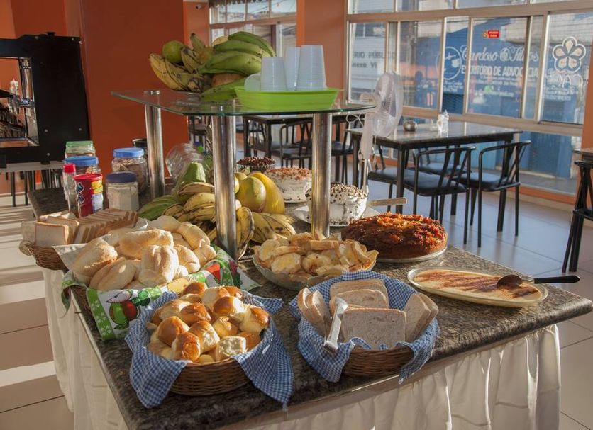 Breakfast buffet at Guarany Hotel Express in João Pessoa with pastries, fruit and coffee station