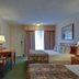 Guest room at Vagabond Inn Ventura in Ventura with two beds, TV, and desk
