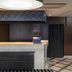 Apa Hotel Tokyo Ojima reception desk with modern lighting and patterned floor in Tokyo