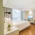 Shama Petchburi 47 Bangkok bedroom with king bed, desk, TV and city-view window