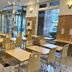 Toyoko Inn Wako-Shi Ekimae in Wako: bright hotel breakfast area with tables, chairs, and vending machines