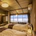 Ooedo Onsen Monogatari Wanwan Resort Yataya Shotoen in Kaga, tatami-style room with twin beds and ocean view