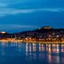 D-Resort Sibenik in Šibenik with waterfront city lights and illuminated hillside at dusk