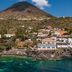 Hotel L'ariana Isole Eolie - Una Esperienze in Leni with sea view and volcano backdrop