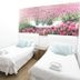 CH La Bañezana Madrid twin room with two single beds and floral wall art