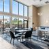 Comfort Inn Aikens Center in Martinsburg breakfast area with tables, chairs, large windows, and lounge seating