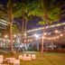 Melia Habana in Havana: palm-filled courtyard with string lights and outdoor seating at night