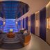W Sydney lobby with curved lounge seating and a dramatic blue-lit glass ceiling in Sydney