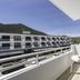 Balcony view at Apartamentos Oasis Sa Tanca in Santa Eulària des Riu overlooking the hotel and hills