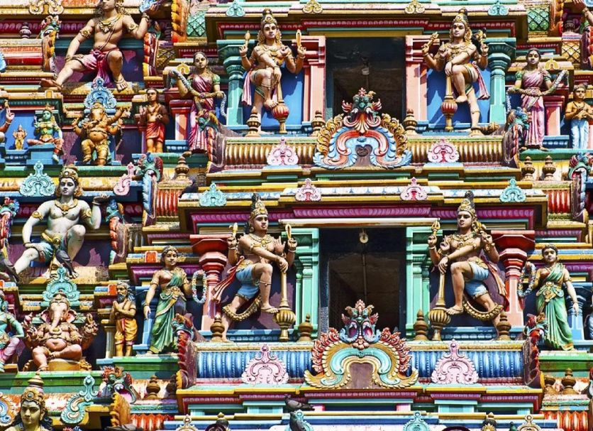 Fabhotel Prime Chennai Deluxe in Chennai with a colorful ornate temple-style facade and sculpted figures