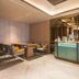 Orange Hotel Beijing Japan Medical University lounge with seating area and front desk, Beijing