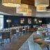 Delta Hotels by Marriott Waltham Abbey restaurant with modern tables, chairs and booth seating