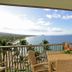 Mana Kai Maui in Kīhei with ocean-view balcony dining table and chairs overlooking the bay