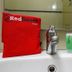 RedDoorz @ Seturan Raya 2 bathroom sink with toiletries and RedDoorz bag in Depok