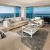 Nirvana By The Sea in Coolangatta with ocean-view living room and floor-to-ceiling balcony windows
