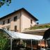 Albergo Michieletto in Montano Lucino with a leafy courtyard and multi-story exterior