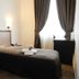 Hotel Chopin Genoa guest room with single bed, dark curtains, and small desk by window