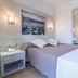 Eix Alcudia Hotel +18 in Alcúdia: cozy guest room with double bed, bedside lamp, and wall mirror