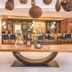 Ferienhotel Sonnenhof in Zell am Ziller, stylish hotel bar and lounge with blue chairs and pendant lights