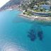 Aerial view of Grand Hotel del Mare Resort & Spa in Bordighera overlooking clear turquoise sea and rocky shoreline