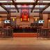 Prairie Band Casino & Resort in Mayetta lobby bar with brick fireplace, stained-glass panel, and high ceiling