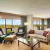 The Westin Southfield Detroit in Southfield suite with city views, sofa, chairs and king bed