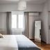 Central Cozy Apartments in Plaka by Upst, Athens bedroom with king bed, window, mirror and wood floors